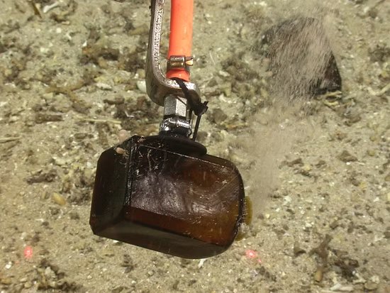 ROV recovering a bottle from the SS Republic shipwreck site
